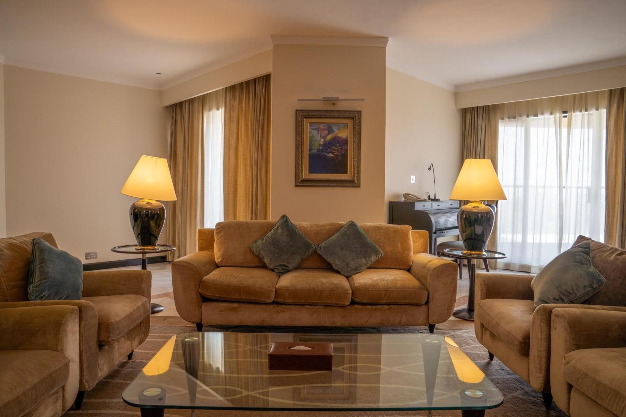 Danat Al Ain Resort Exterior photo A living room in a suite at the hotel