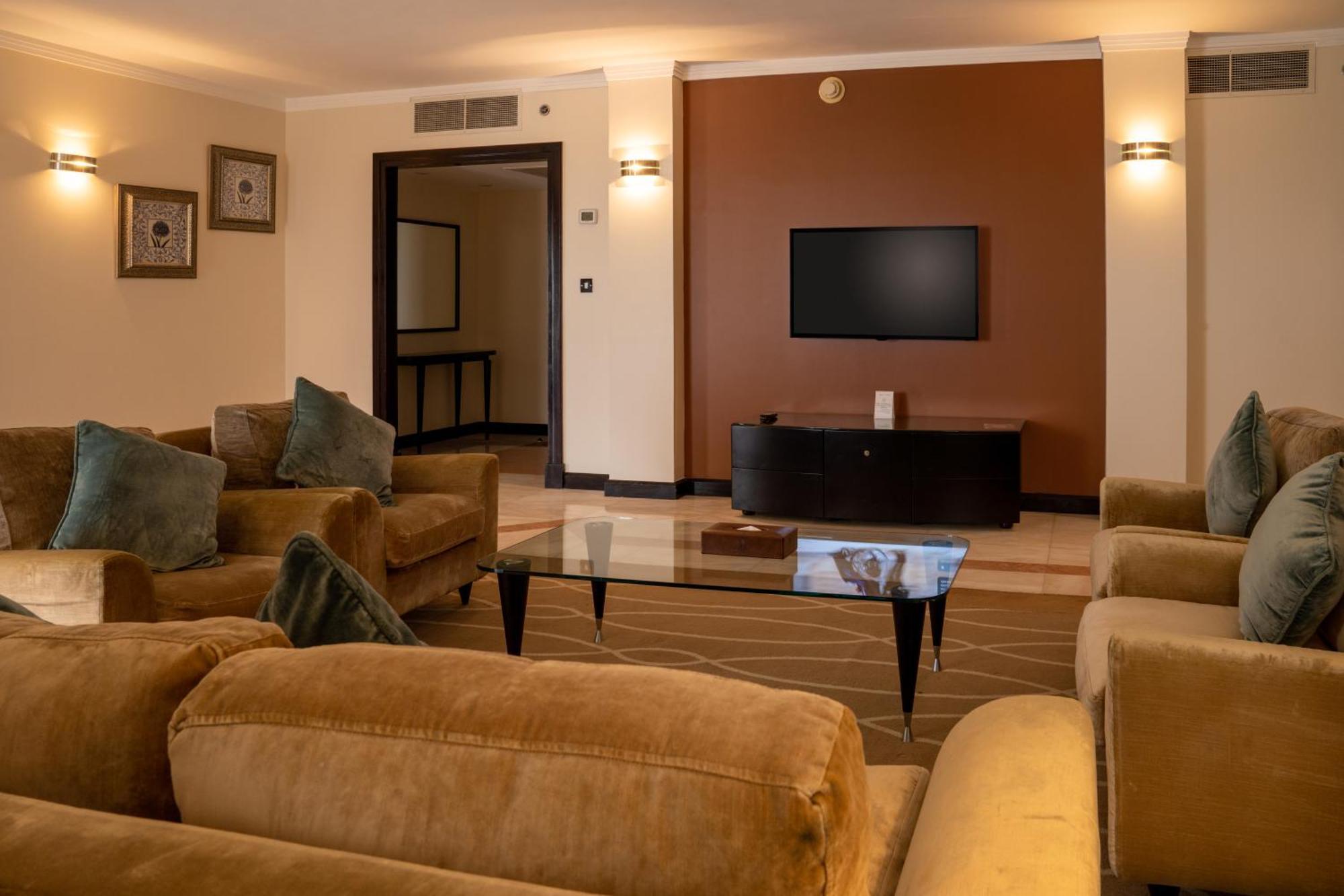 Danat Al Ain Resort Exterior photo A living room in a suite at the Taj Mahal Palace, Mumbai