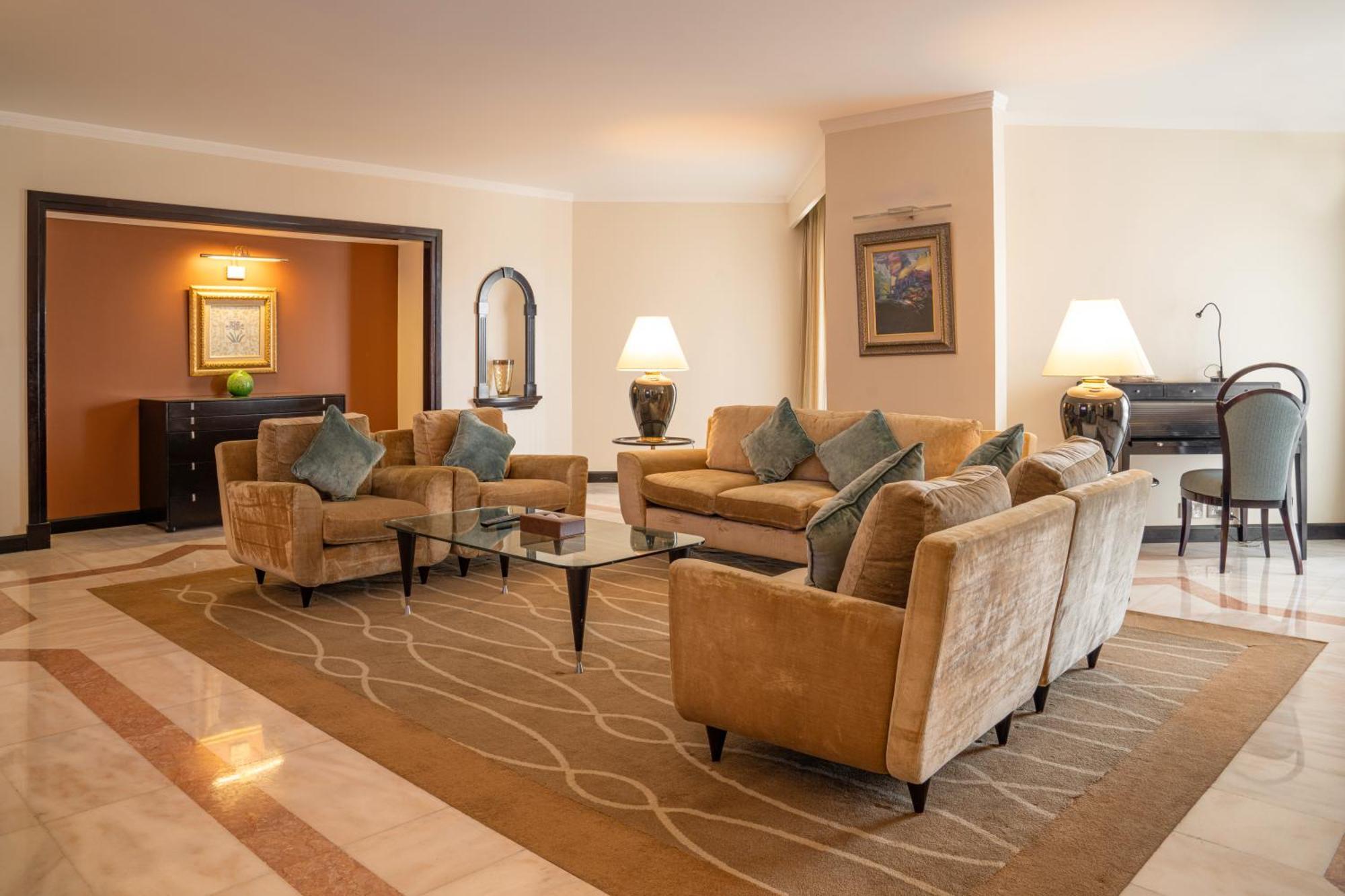 Danat Al Ain Resort Exterior photo A living room in a suite at the Jumeirah Emirates Towers Hotel