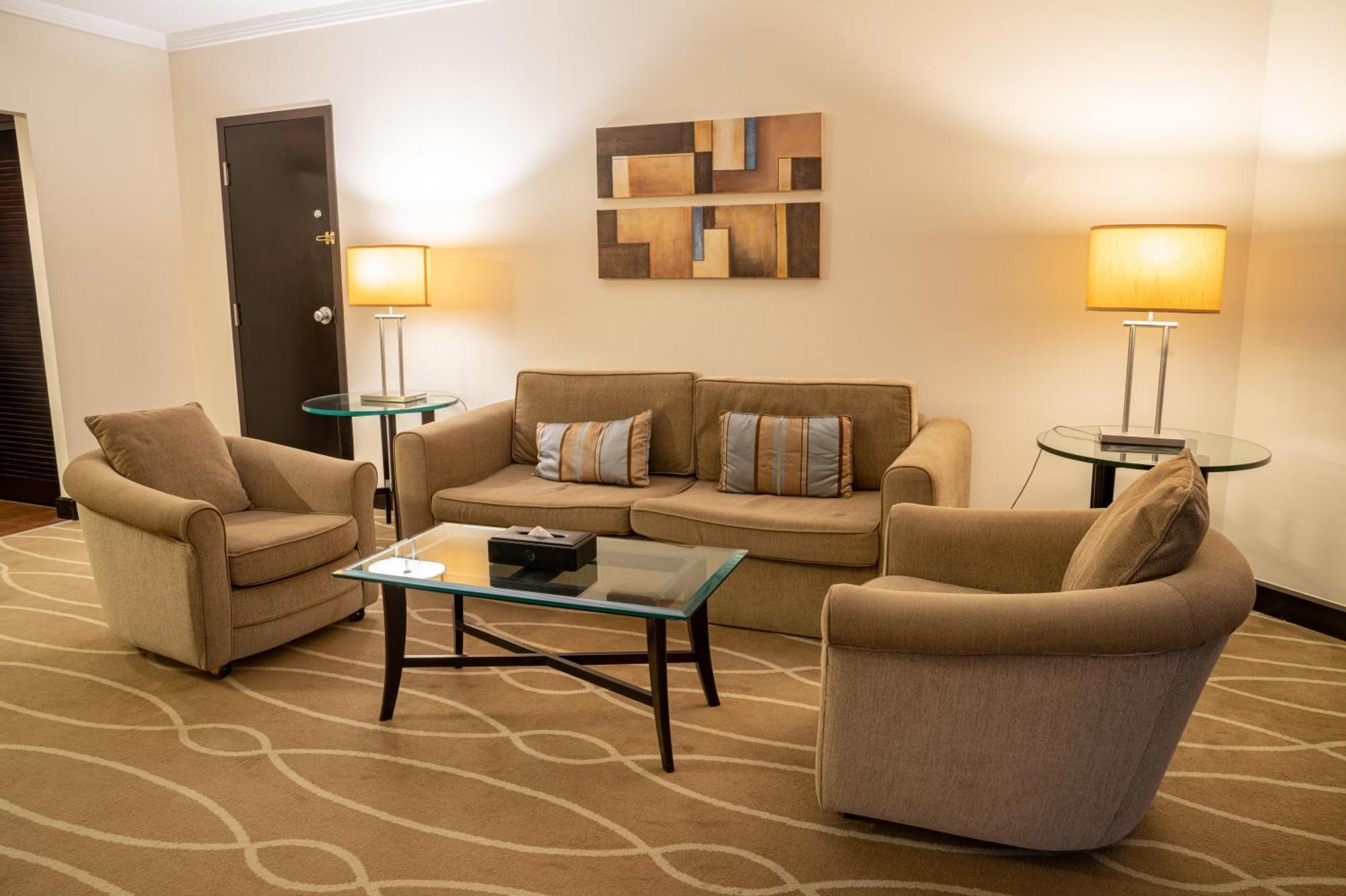 Danat Al Ain Resort Exterior photo A living room in a suite at the Fairmont